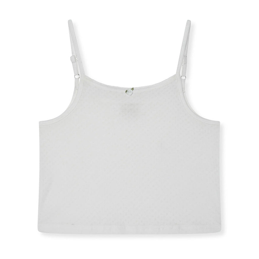 White tank top with thin straps on a white background
